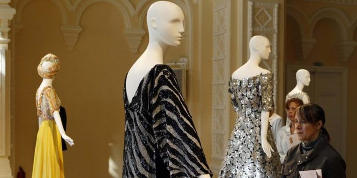 Visitors look around of a show of Elizabeth Taylor's collection of jewelry, paintings and costumes held in Moscow's GUM shopping centre on Red Square -0OOE3358.jpg-