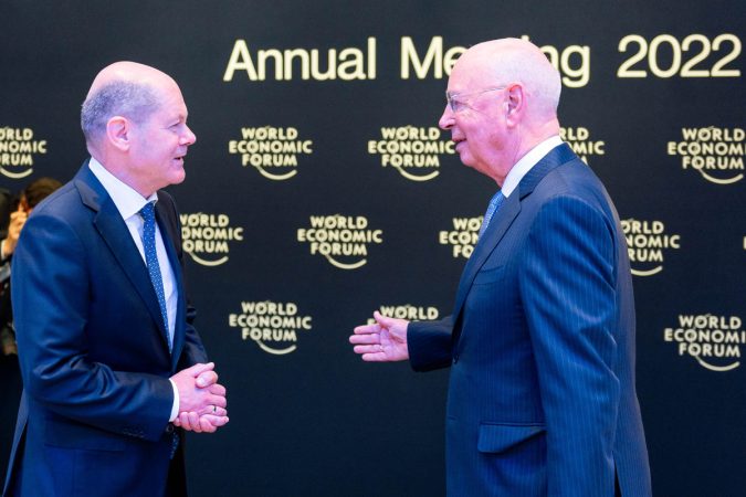 Klaus Schwab, Founder and Executive Chairman of the World Economic Forum, receives German Chancellor Olaf Scholz, at the World Economic Forum Annual Meeting in Davos