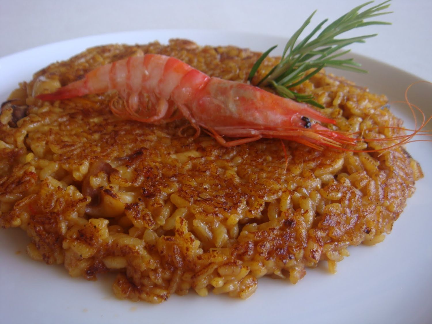 La innovación culinaria de Quique Dacosta: receta de arroz al socarrat