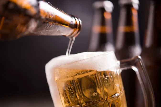 glass bottles beer with glass ice dark background Merca2.es