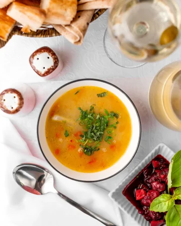 top view chicken soup bowl served with feijoa kompot bread Merca2.es